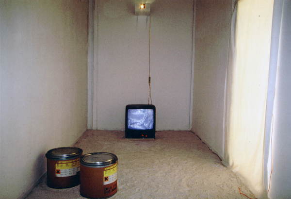 Exhibition space with television and 2 cylinders