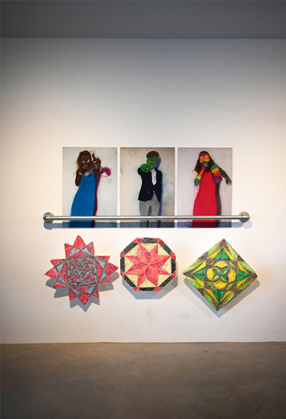Installation of 3 photographs of youths each with an abstract relief underneath