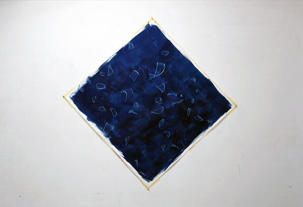 A red wall sculpture and an animation shown on a screen placed on the floor